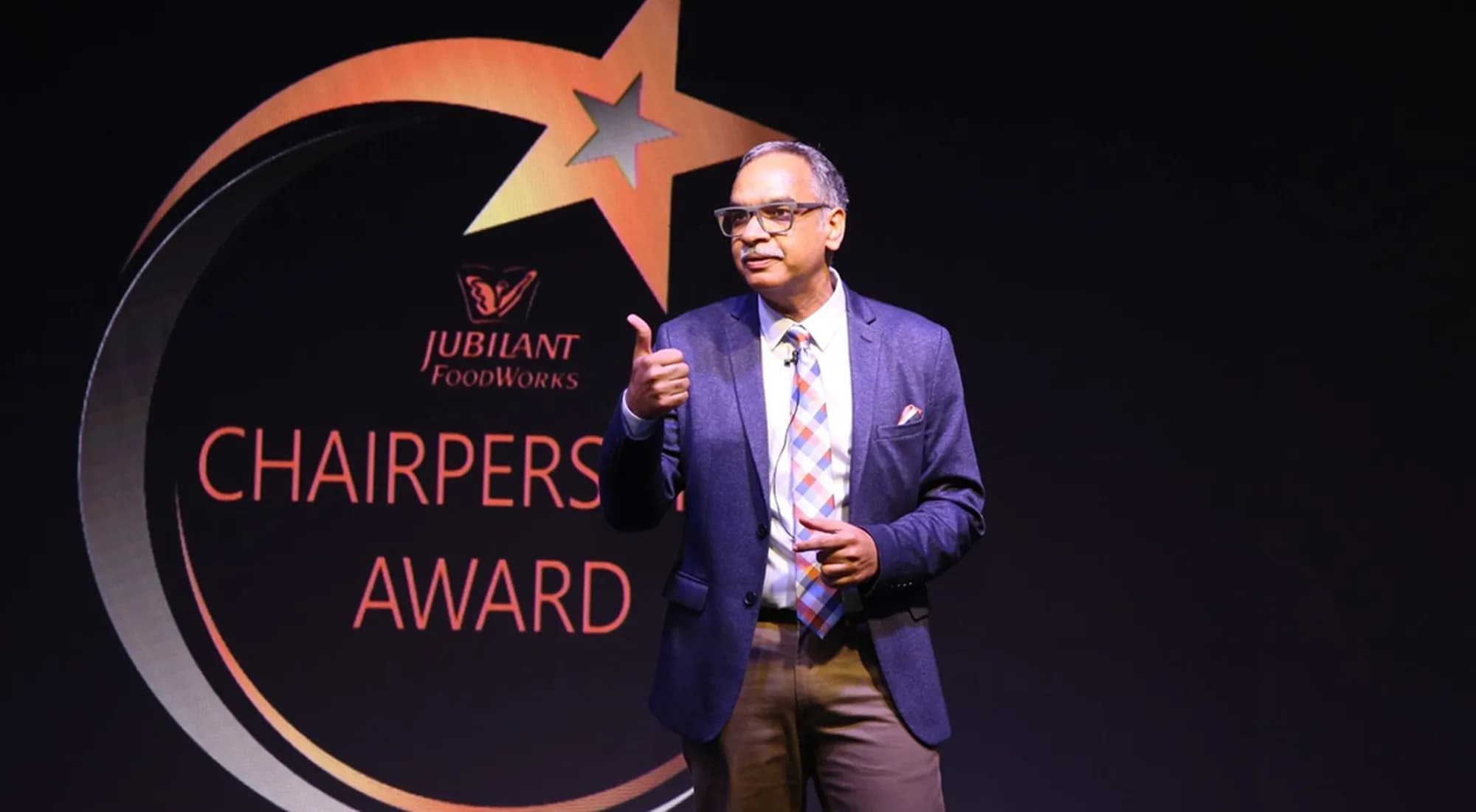 Chairperson presenting recognition award